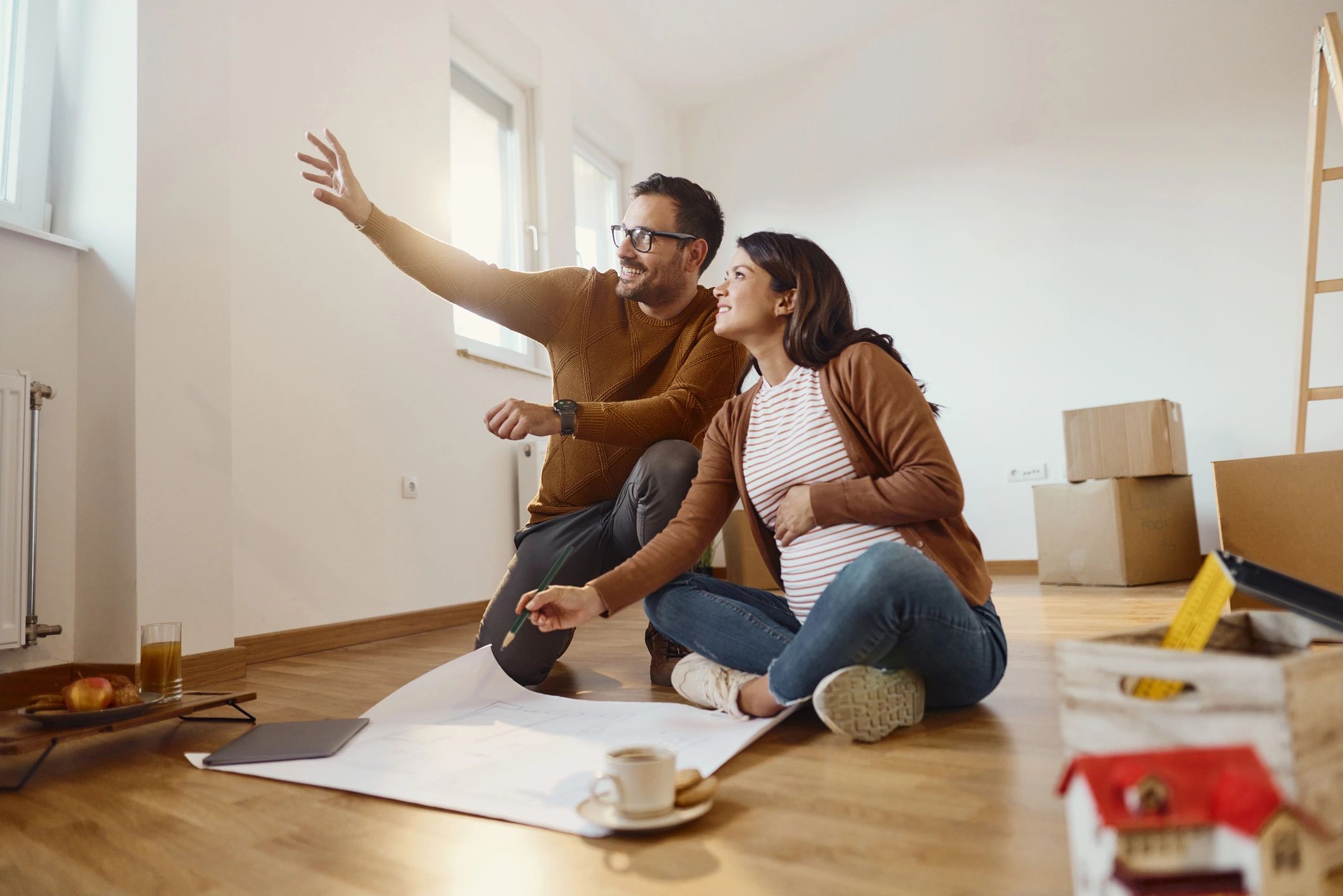Happy homeowners reviewing plans