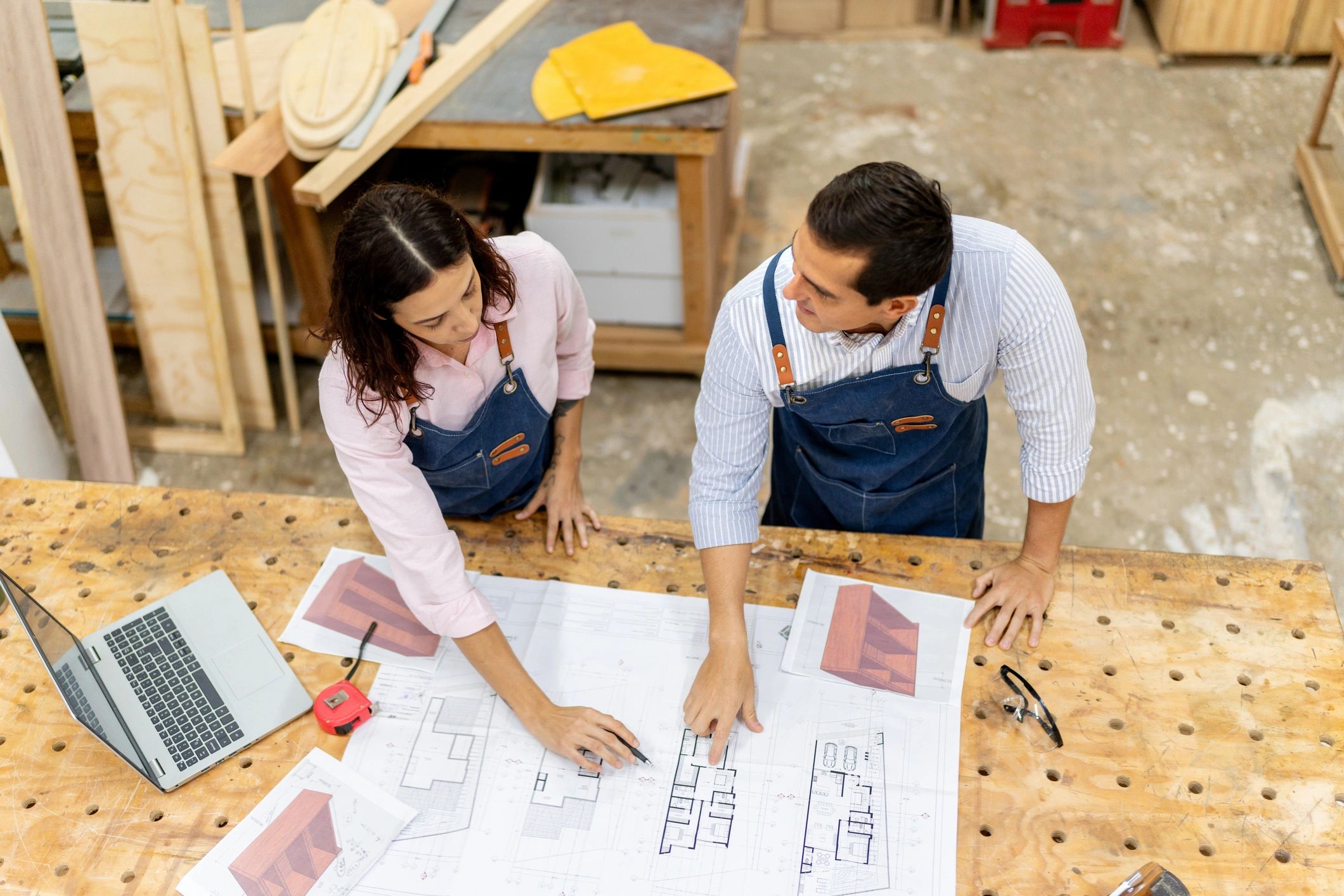 Builders discussing work on site
